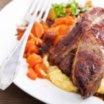 Chipotle Garlic Crusted Pork Tenderloin with Chipotle Cheddar Creamy Polenta