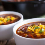 Homemade Chili Recipe with Cilantro and Cheddar Cheese