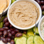 Gourmet dip platter with olives, pickles, cucumbers and cherry tomatoes